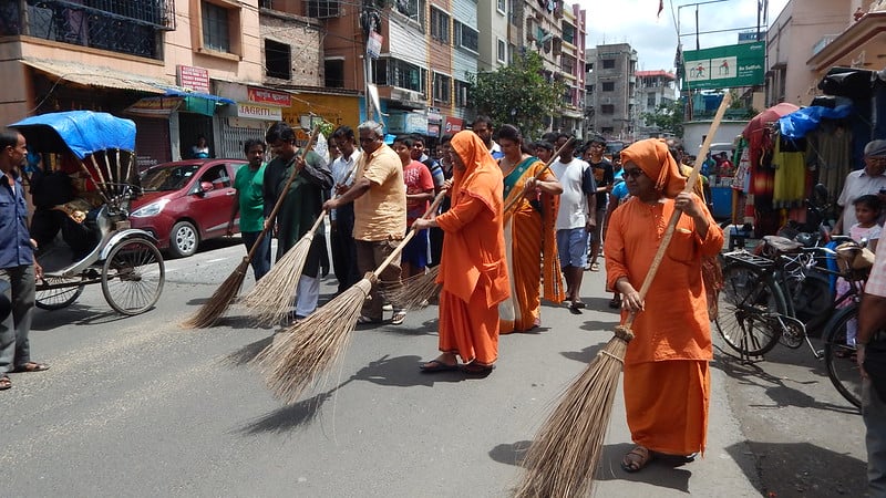 Women sweeping the roads