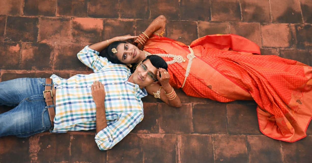 young couple lying on the ground