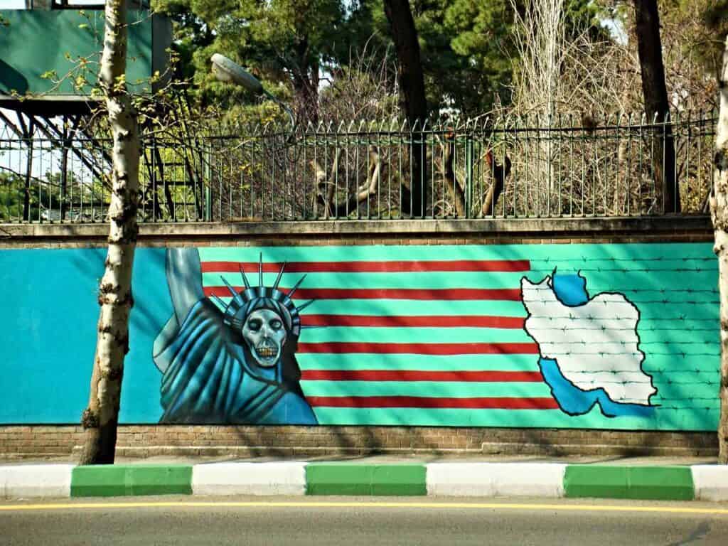 The infamous skull graffiti of the former US Embassy, one of the places you need to visit in Tehran