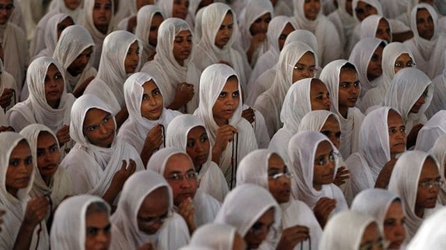 Jain nuns sitting in white dress