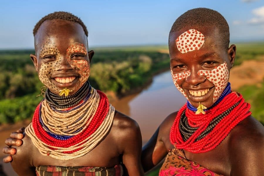 Two children with decorated faces from the Karo tribe in Ethiopia