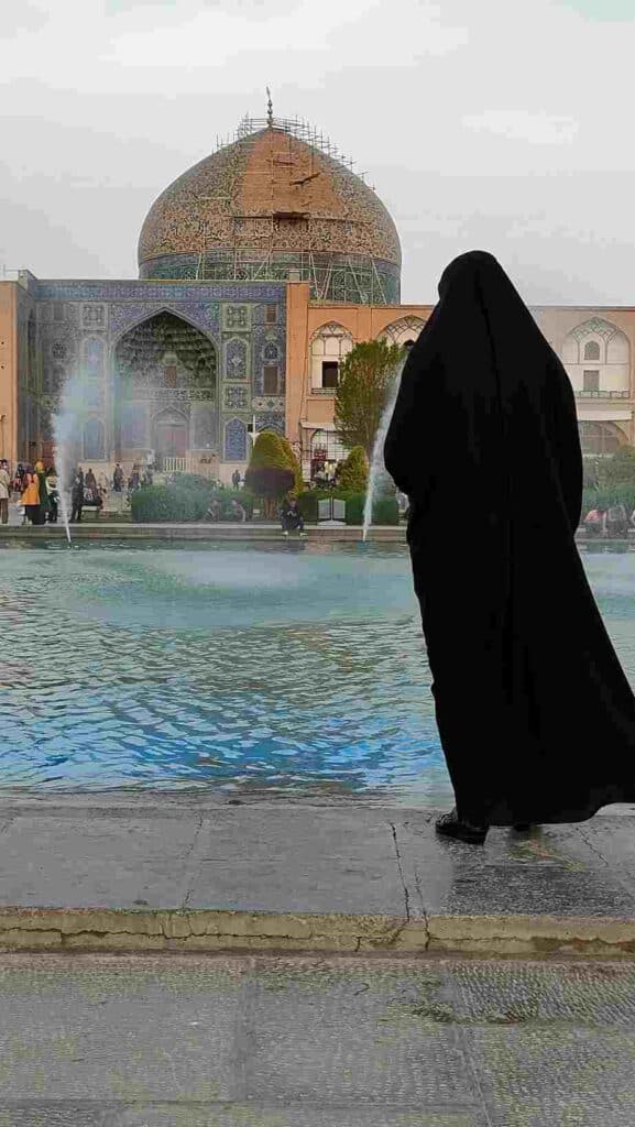 religious Iranian woman wearing black cagor in Isfahan