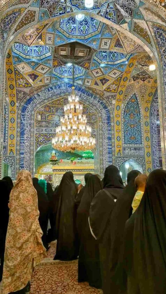 Imam Reza holy shrine in Mashhad, women in chador are lining up to touch the tomb