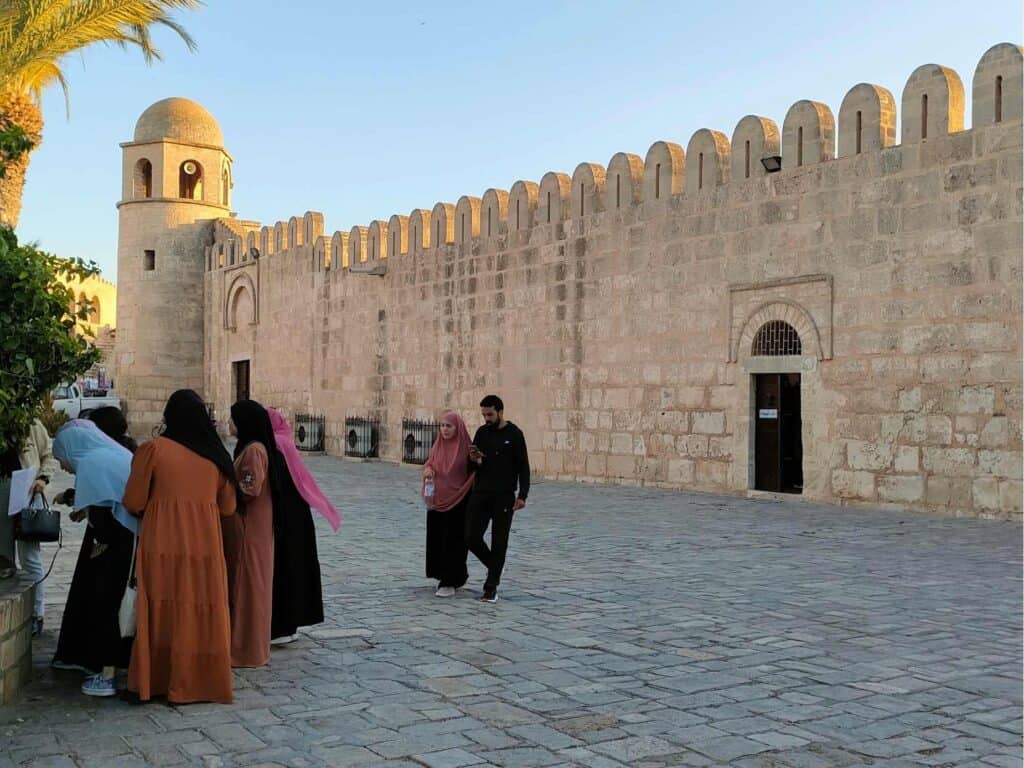 Tunisian women next to Sousse Grand Mosque